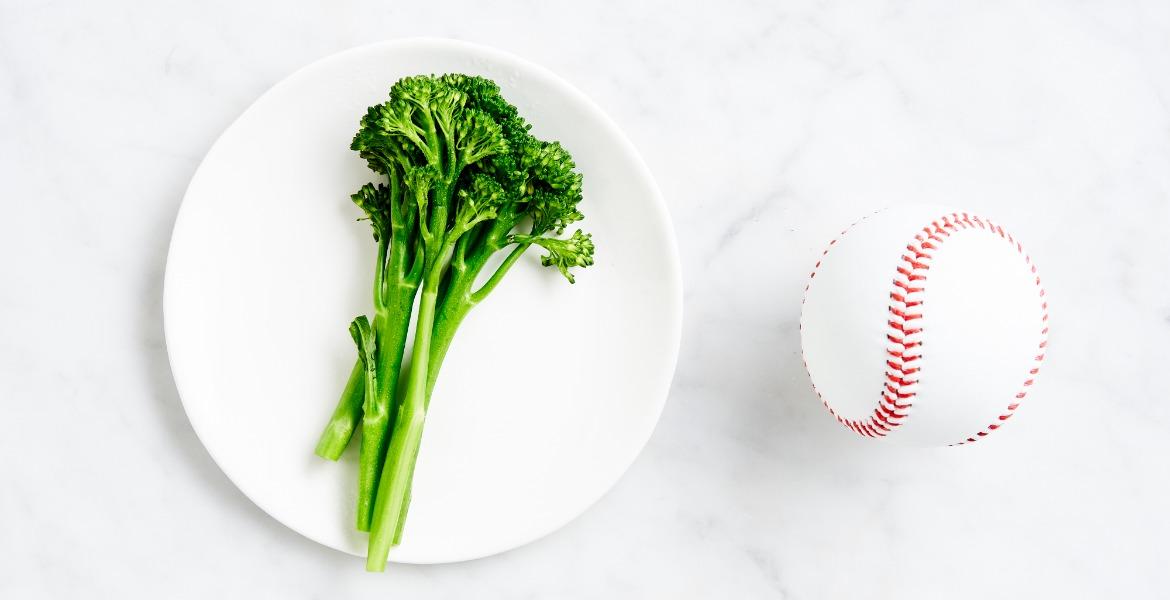 Broccolini on a plate to demonstrate the a suggested portion size 
