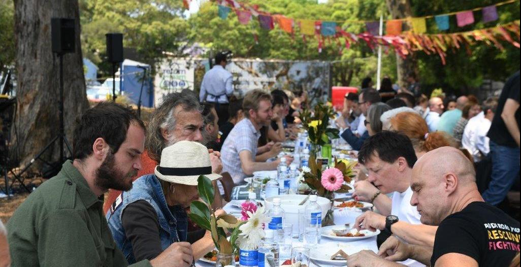 Image of people eating at a table outside