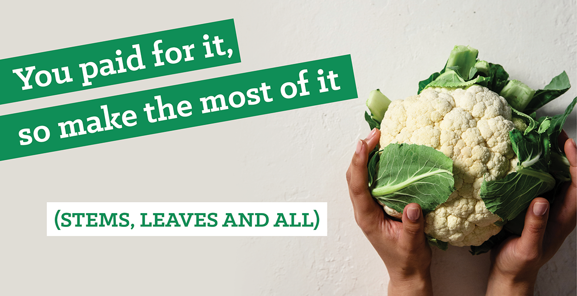 Hands holding whole cauliflower