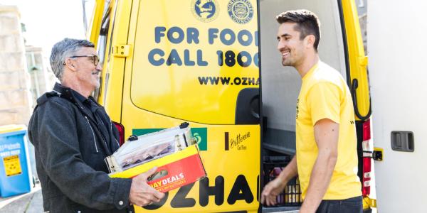 Oz Harvest driver receiving a food donation