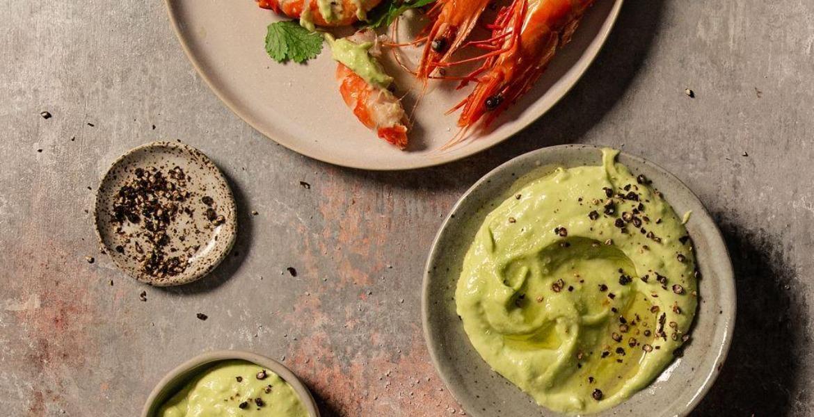 Avocado aioli sits in serving dish on table