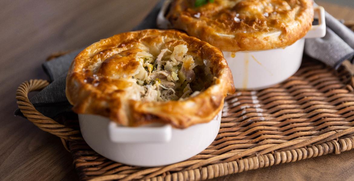 chicken pot pies on a wicker tray