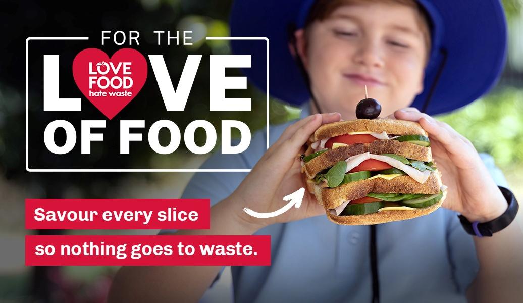 Schoolboy holds up super sandwich