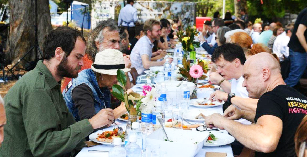 People eating at a table outside